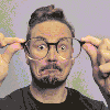 Me holding my eyeglasses in front of my face